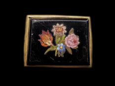 A micromosaic brooch, rectangular onyx panel inlaid with floral micro mosaic detail, in a