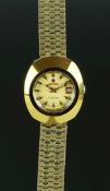 LADIES' RADO DIASTAR WRISTWATCH, circular gold dial, baton hour markers and a date aperture, 26mm