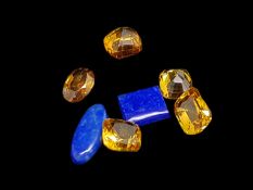 Selection of loose stones, four yellow sapphires, zircon and two lapis lazuli