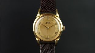 GENTLEMEN'S TISSOT 18K GOLD WRISTWATCH, circular two tone champagne dial with dot hour markers and