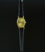 LADIES' OMEGA DE VILLE WRISTWATCH, oval gold dial with baton hour markers and black hands, 18mm g/