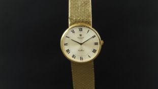 MID SIZE ROLEX CELLINI 18K GOLD REF. 4309, circular silver dial with roman numerals, 32mm 18k gold