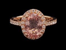 Morganite and diamond ring, oval cut morganite weighing an estimated 2.54ct, surrounded by round