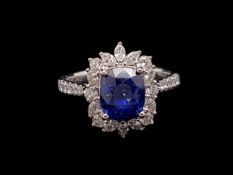 Sapphire and diamond ring, central cushion cut sapphire weighing an estimated 2.76ct, surrounded