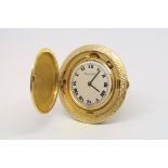A vintage Bueche-Girod miniature travel clock, circular white dial with Roman numerals and outer