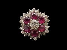 Ruby and diamond ring, central round brilliant cut diamond weighing an estimated 0.45ct,