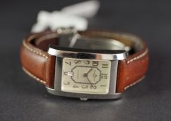 MID SIZE BAUME AND MERCIER WRISTWATCH, rectangular beige dial with silver arabic numerals, 24mm