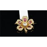 Ruby, diamond and pearl five leaf clover brooch, set with a central old cut diamond and five leaves,