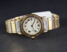 MID SIZE CARTIER 18K GOLD WRISTWATCH, circular beige dial with roman numerals and a date aperture,