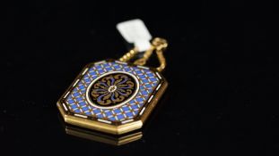 Antique enamel locket, rectangular shape with cut corners with enamel on both sides, the front is