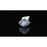 Star sapphire and diamond ring, central round cabochon cut star sapphire, with diamond set