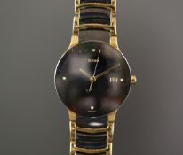GENTS RADO CENTRIX WRISTWATCH, circular black dial with gold hour markers and hands, date