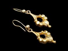 A pair of gold drop earrings, with engraved detail, French wire fittings