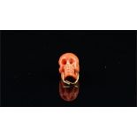 Coral carved skull bead