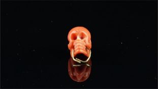 Coral carved skull bead