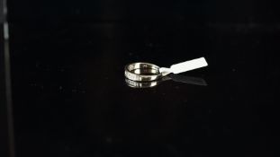 Diamond half eternity ring, graduated baguette cut diamonds, set in white metal, with indistinct