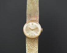 LADIES ROLEX 9K GOLD WRISTWATCH, circular silver dial with gold hour markers, in a 21mm 9k gold case