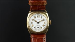 GENTLEMEN'S J.W. BENSON GOLD TRENCH WATCH, circular white dial with gold painted Arabic numerals and