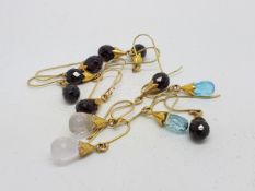 Six pairs of briolette cut drop earrings, all mounted in gold plated silver, on French wire