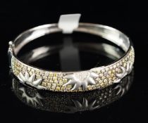 Diamond set bangle, wide diamond set panel with sun detail, set with yellow and white round