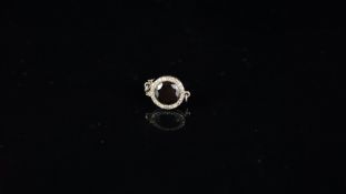 Onyx and diamond clasp, circular faceted onyx, with an old cut diamond surrounded, mounted in