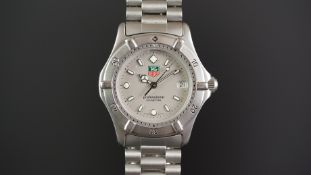MID SIZE TAG HEUER WRISTWATCH, circular grey dial with luminous hour markers, date aperture,