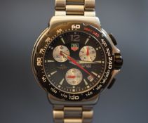 GENTLEMEN'S TAG HEUER INDY 500 CHRONOGRAPH WRISTWATCH REF. CAC111A, circular black dial triple