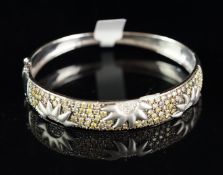 Diamond set bangle, wide diamond set panel with sun detail, set with yellow and white round