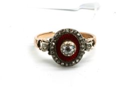 Georgian enamel and diamond ring, central old cut diamond surrounded by red guilloche enamel, and