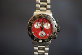 GENTLEMEN'S TAG HEUER FORMULA 1 CHRONOGRAPH REF. CAC1112, circular red triple register dial with