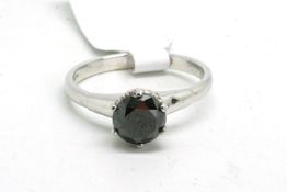 Single stone gem set ring, set with a round black faceted stone, mounted in 9ct white gold,