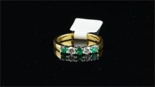 Five stone emerald and diamond half eternity ring, three round cut emeralds and two round
