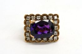 Amethyst and diamond ring, emerald cut amethyst, claw set, surrounded by single cut diamonds, with a