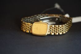 LADIES' OMEGA WRISTWATCH, rounded square gold dial with gold hour markers, 18mm gold plated case,