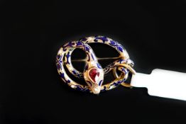 Ruby and enamel snake pendant/brooch, designed as a coiled snake, with blue and white enamel