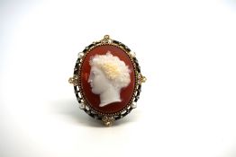 Cameo brooch, oval carnelian base, surrounded by rose cut diamonds, pearls and black enamel, mounted
