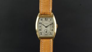 GENTLEMEN'S TAVANNES 18K GOLD WIRSTWATCH CIRCA 1926, rounded aged silver dial with Arabic numerals