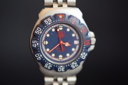 MID SIZE TAG HEUER PROFESSIONAL WRISTWATCH REF. WA1210, circular blue dial with luminous and gold