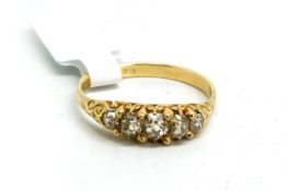 Five stone carved half hoop diamond ring, set with five graduated old cut diamonds, weighing an