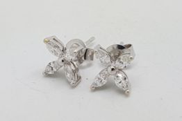 A pair of diamond earrings, floral design set with four marquise cut diamonds, estimated total