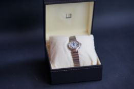 LADIES DUNHILL, white dial with black Roman numerals, stainless steel case and bracelet,