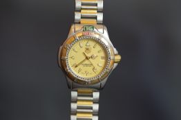 GENTLEMEN'S BI-COLOUR TAG HEUER QUARTZ DATE WRISTWATCH, REF 995.413K, round champagne dial, gold