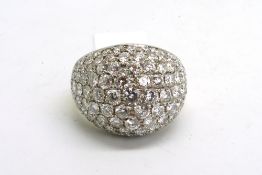 A vintage pave set diamond bombé ring, the domed top with round brilliant cut diamonds, weighing
