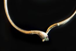 A vintage ruby snake necklace, designed as a snake biting his tail, connected by a gaspipe necklace,