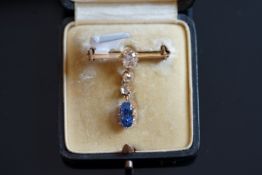 An antique sapphire and diamond brooch, central old mine cut diamond weighing an estimated 0.75ct,