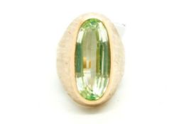 Single stone spinel ring, greenish blue spinel, set in a heavy yellow metal mount, bearing French