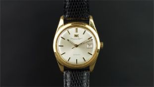 GENTLEMEN'S IWC 18K GOLD WRISTWATCH, circular silver dial with gold baton hour markers, a date