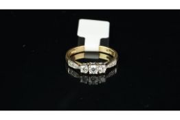 A cubic zirconia ring, set in yellow metal, ring size L