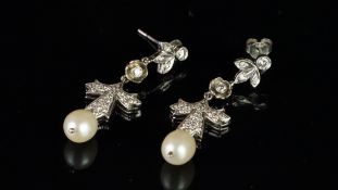 Pearl and diamond drop earrings, three sections of round brilliant cut diamonds, suspending a 9 x