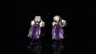 Amethyst and diamond drop earrings, pear cut amethyst drop, claw set, suspended from a round cut